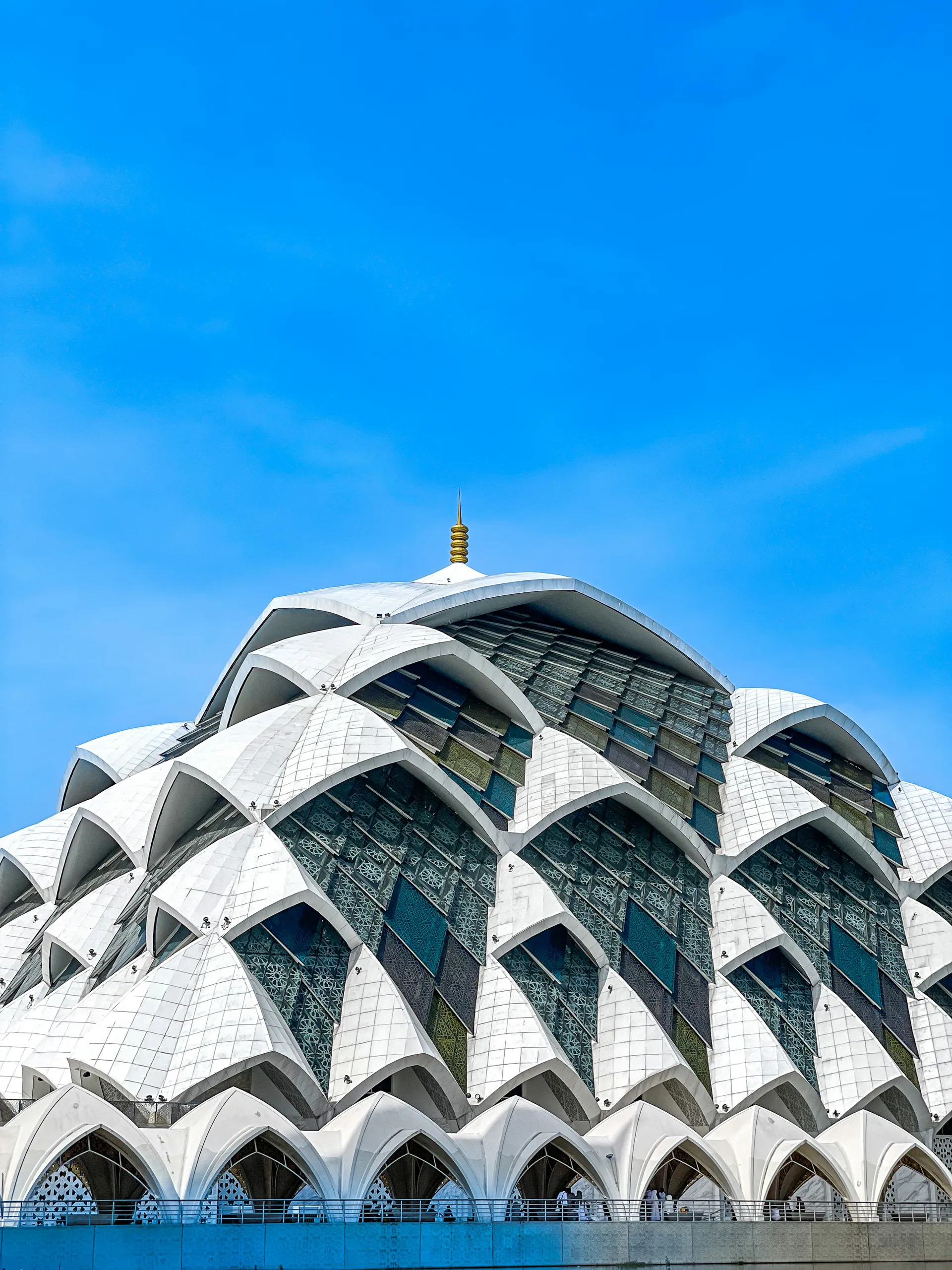 Modern white mosque with green gardens in Bandung